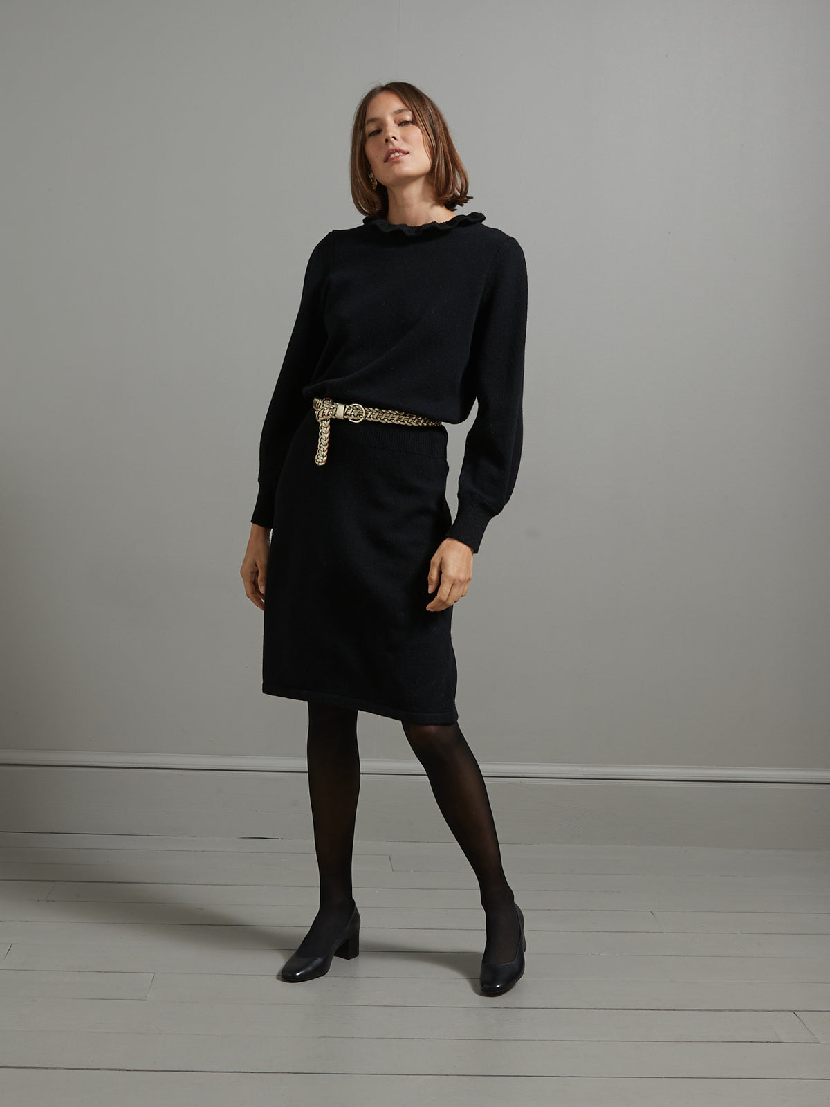 Zwarte tricot damesjurk met ruchekraag