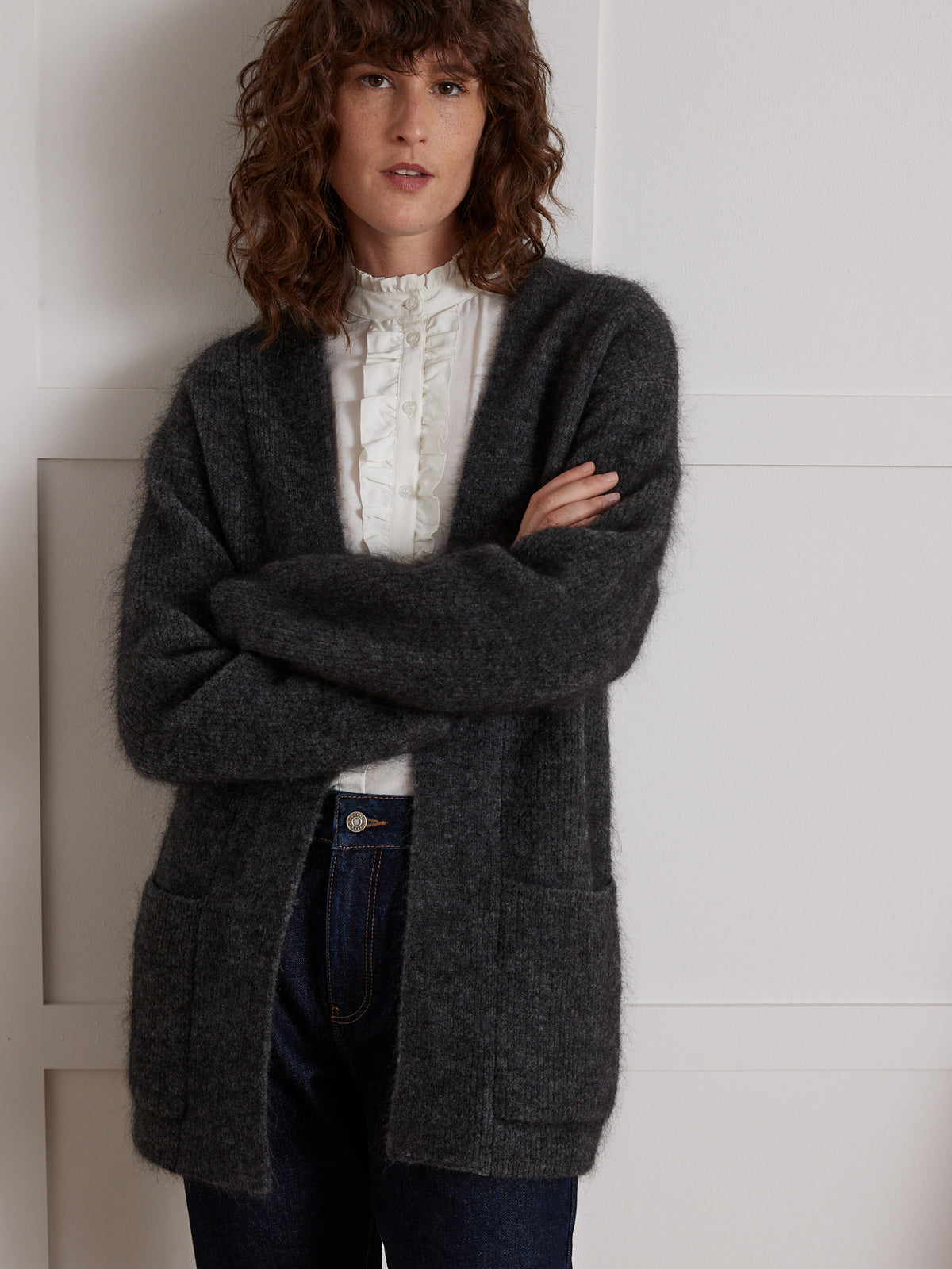 Lang damesvest in chiné tricot