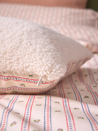 Kussenhoes met print en sherpa "Avril"