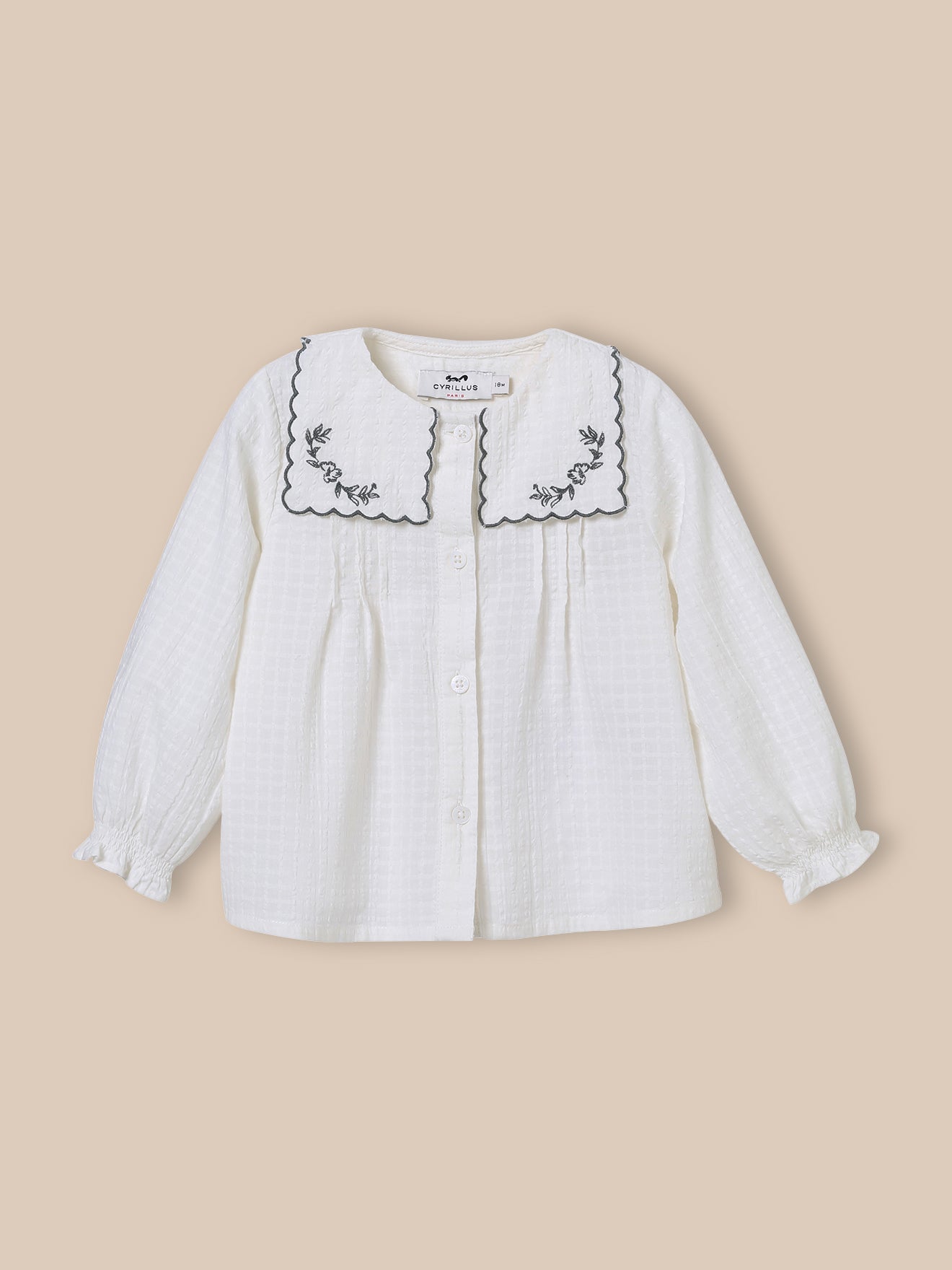 Babybloesje met geborduurde kraag