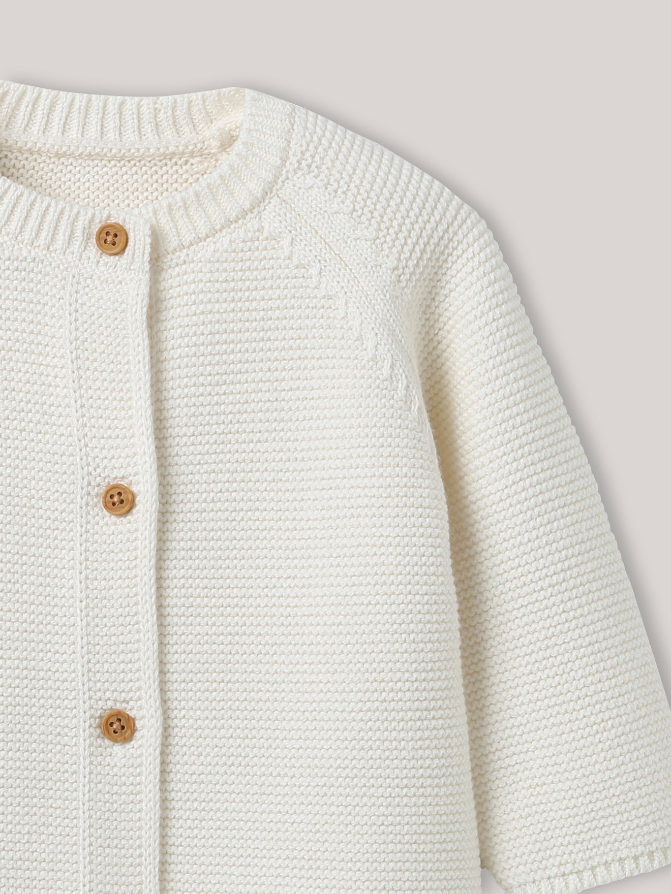 Babycardigan in biokatoen en wol