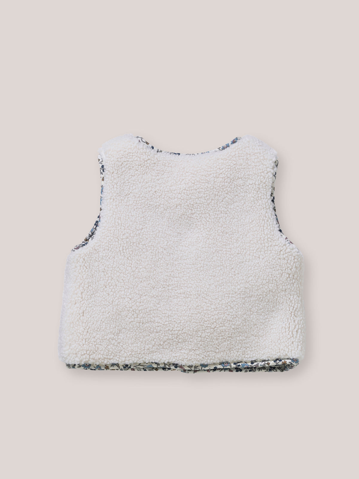 Omkeerbaar mouwloos babyvest