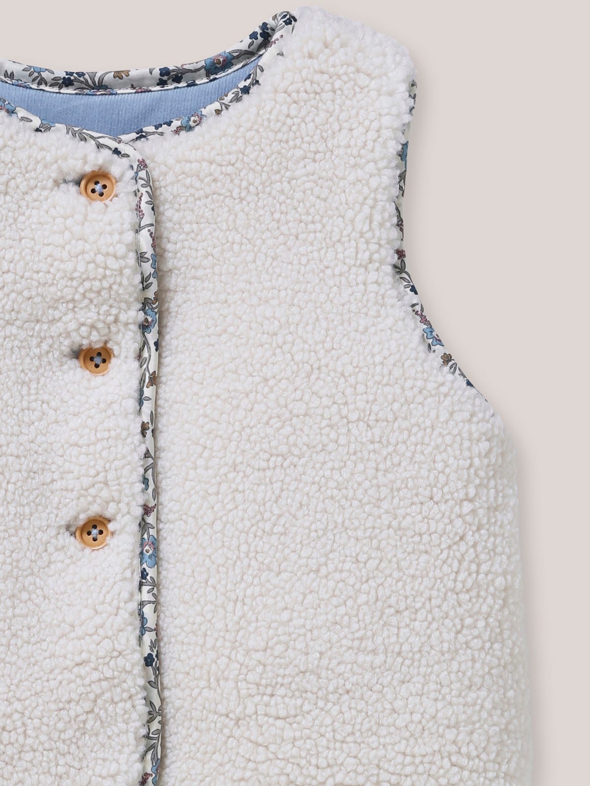 Omkeerbaar mouwloos babyvest
