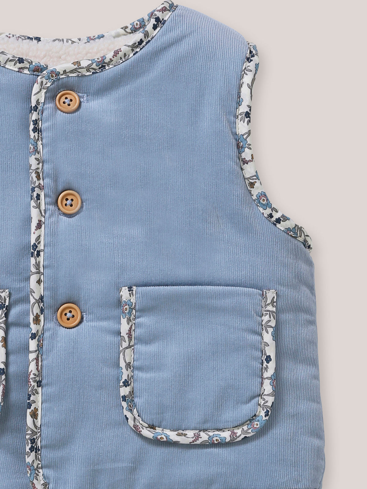 Omkeerbaar mouwloos babyvest