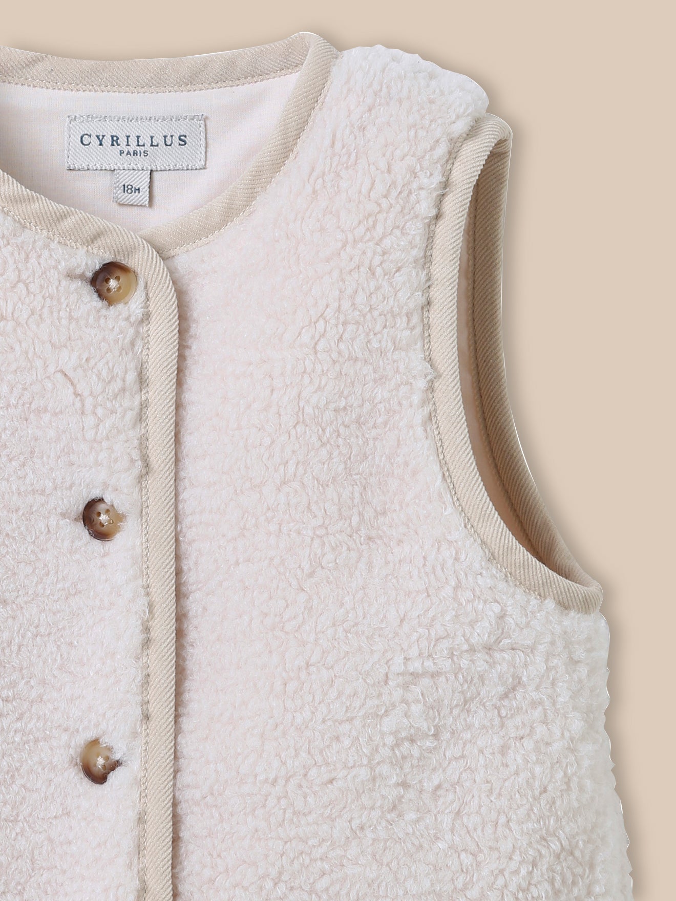 Mouwloos babyjasje in sherpa