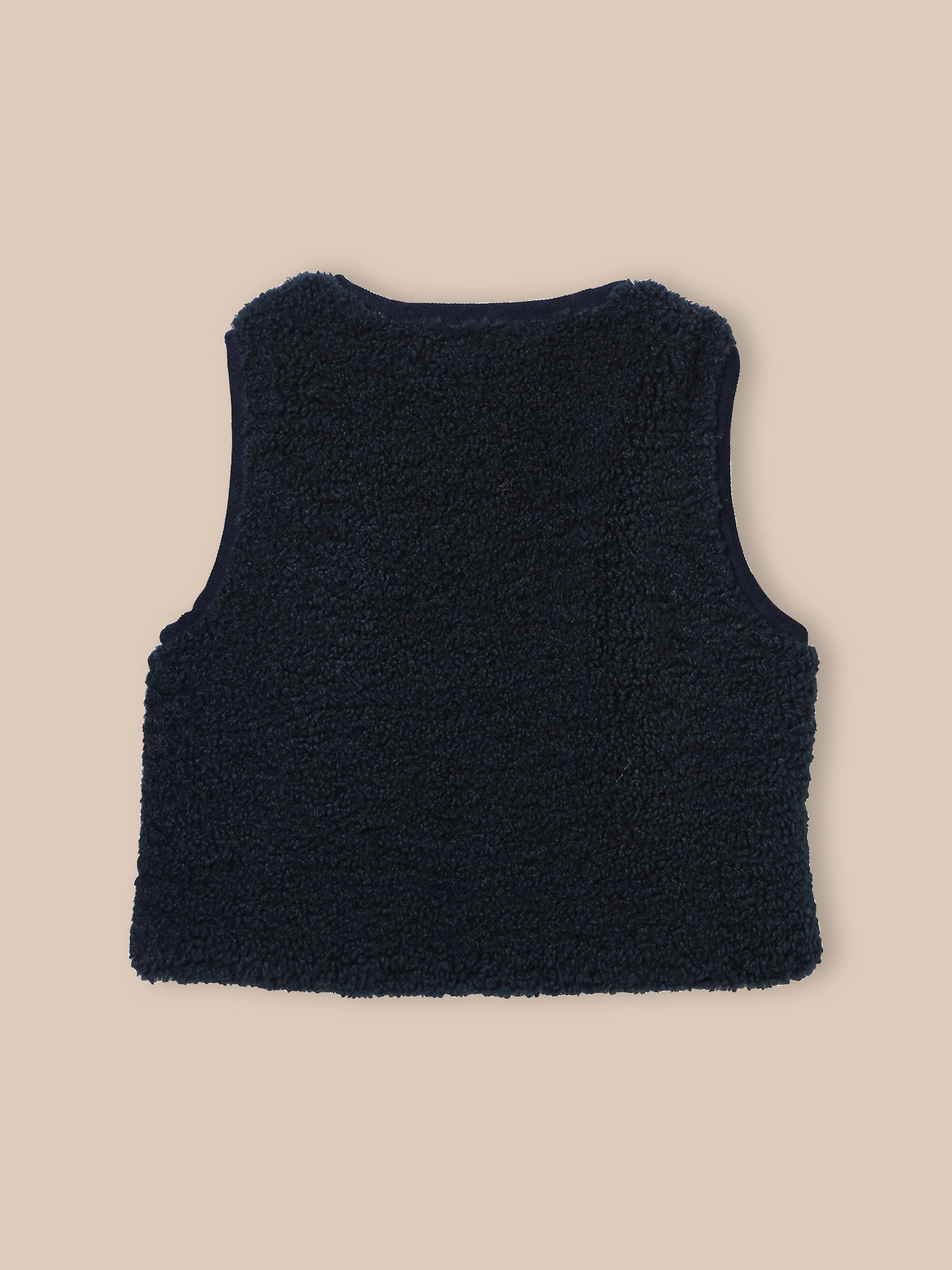 Mouwloos babyjasje in sherpa