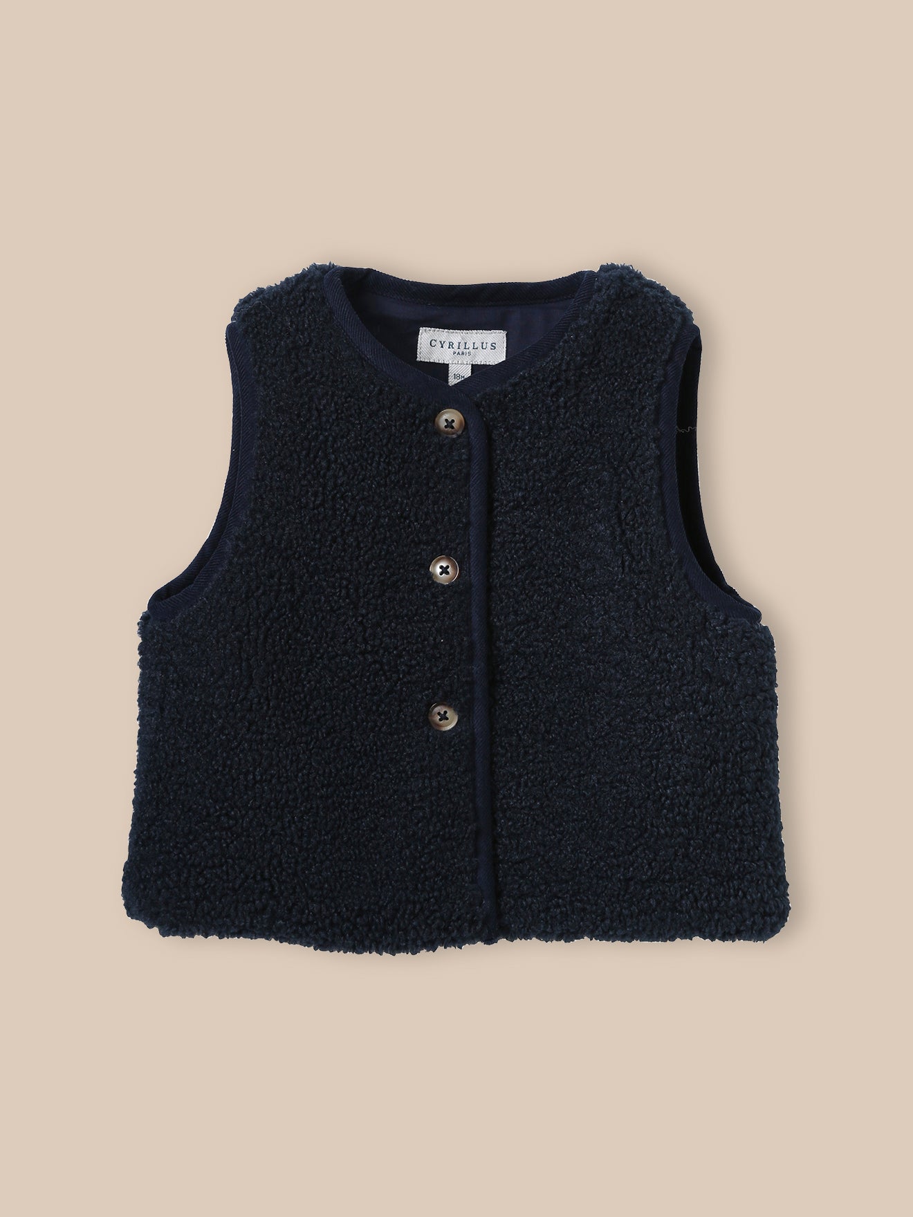 Mouwloos babyjasje in sherpa