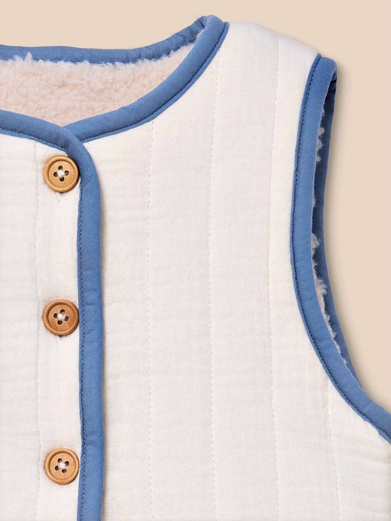 Omkeerbaar mouwloos babyvestje