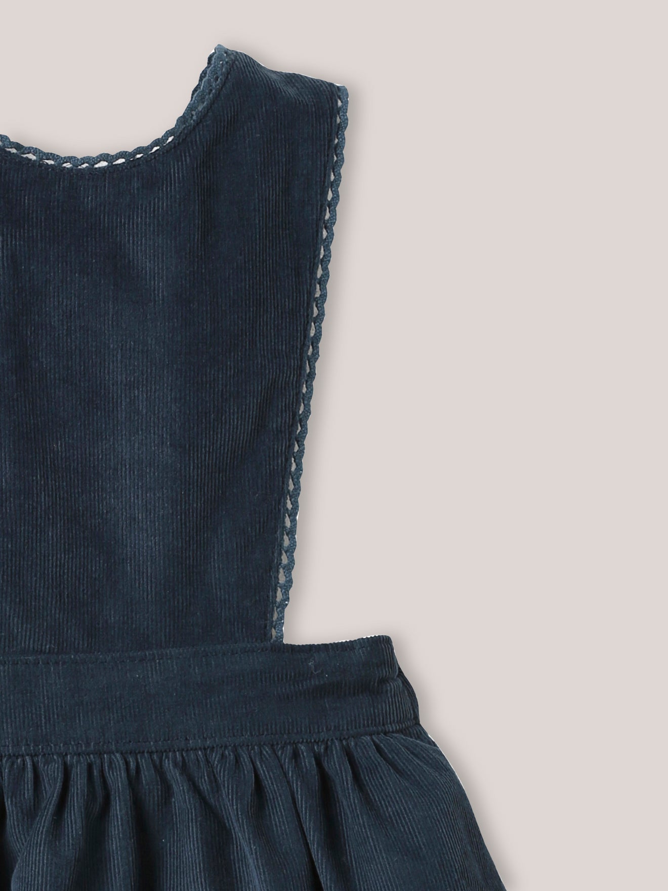 Velours babyjurk in salopettemodel