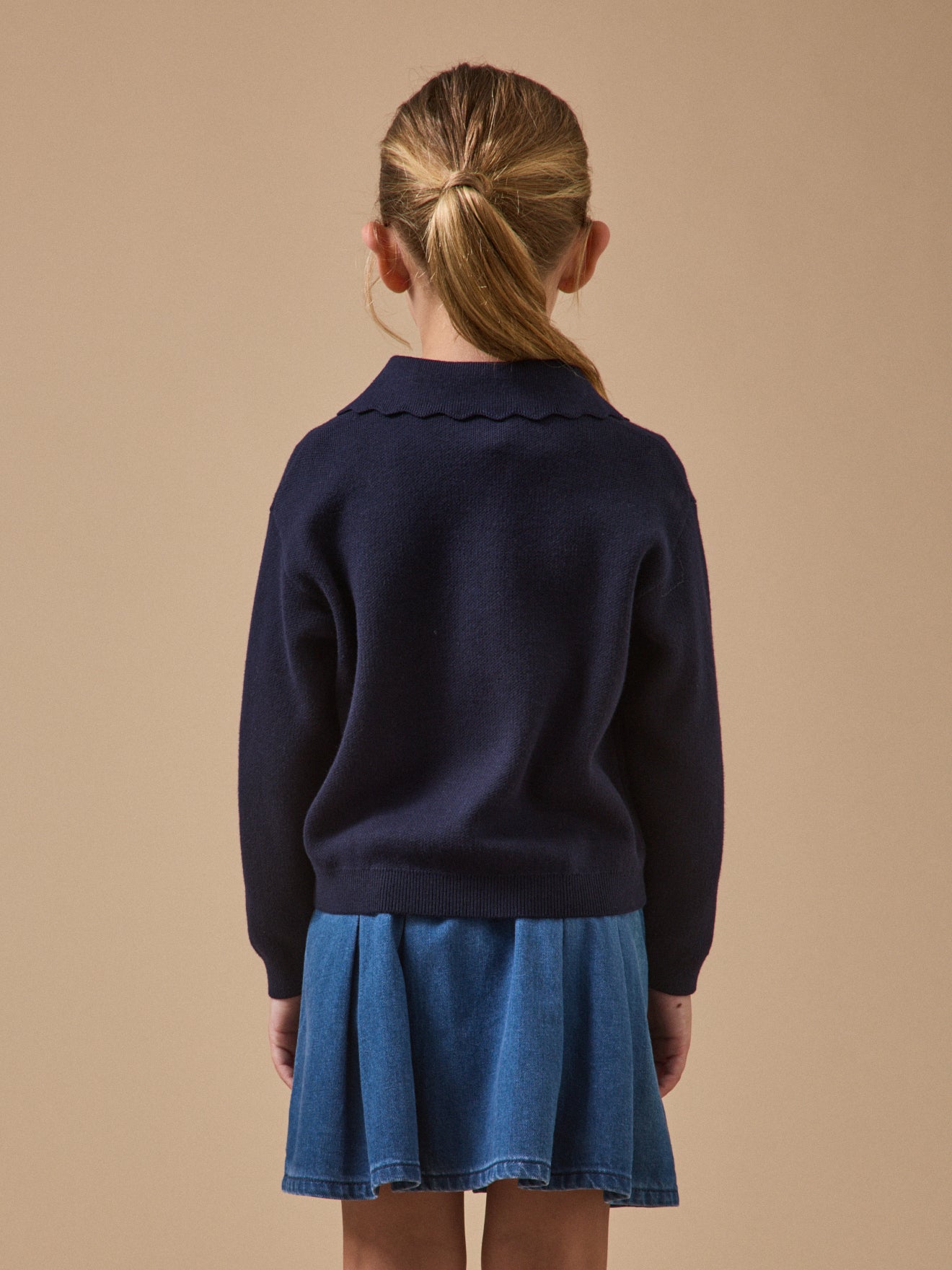 Meisjestrui in milanotricot met polokraag